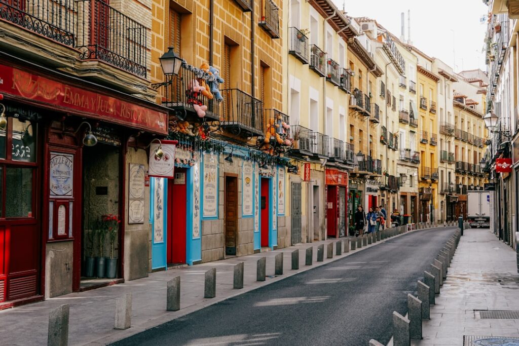 a street lined with tall buildings next to each other