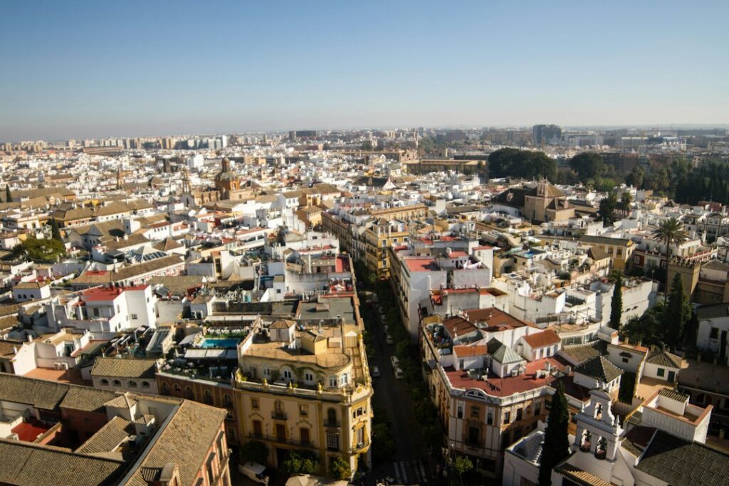 Aerial view of a dense european city with white buildings