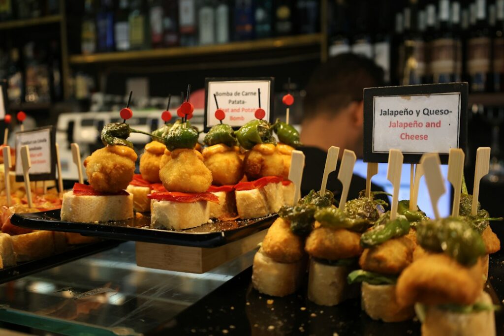 Assorted spanish pintxos displayed on a bar counter